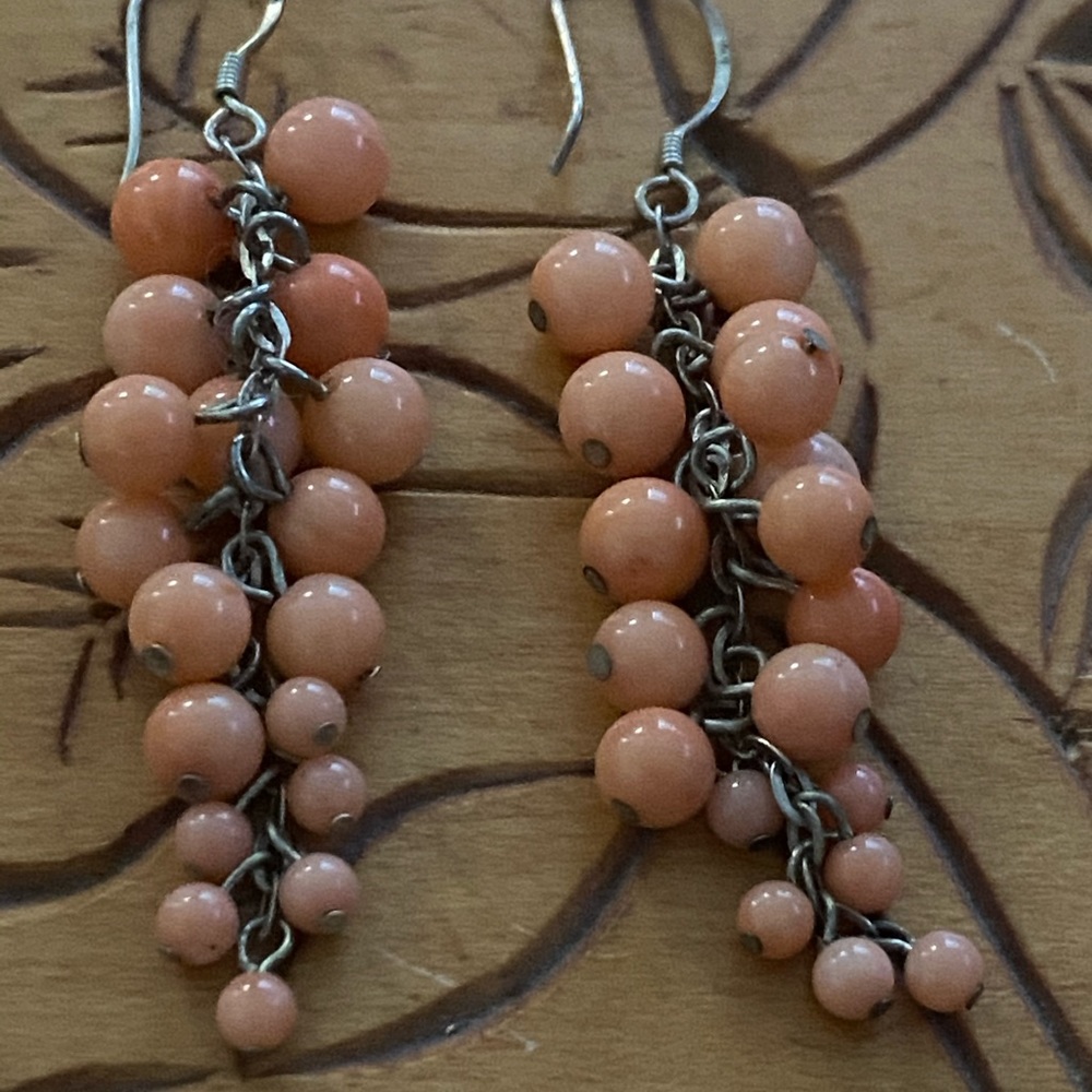 Coral beads on sterling silver pierced earrings.